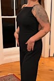 I ordered this to bartend a wedding. Wanted something professional, yet still sexy. This fit the bill. I'm typically a large in all things Lulus, but I have an extremely long torso so I ordered the XL to accommodate for extra torso length. It was the perfect length in the body, the straps pretty much stayed put through making drinks, and it was thick enough that just some KT tape for a makeshift bra was sufficient. As suspected the legs were very long, so I wore 4-inch heels but will need to hem it a touch for future wear. I got tons of compliments and felt great. 10/10. - Marit J.