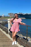 Material is soft and fits very well. Sexy yet super cute. I think it fits perfect however I am 5'4" and it's just a little short during a windy day. I have a small figure so it works for me however if you have a big butt I recommend going up a size unless you like your butt cheeks out :) - Karina M.