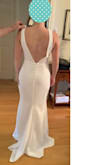This dress was beautiful - beautiful mermaid silouhette and elegant. I wanted to share two photos of the back where I've had to have small adjustments done. The clasp at the back isn't tight enough and leaves much of the zipper exposed - we added a hook-and-eye fastener, which is extremely simple to do. The second adjustment was on the lenght of the sleeves. I do not have the long back of a model and we had to make them shorter to prevent sagging (as you can see on the picture).
I highly recommend the dress. I felt like a million bucks! - Vero D.
