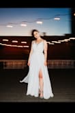 I wore this dress for my wedding, and it was absolutely perfect. Very comfortable and very well-made! I did have to get the length altered and I added a new back clasp because the existing one seemed flimsy. I love the corset back, it gives you the ability to fit the dress perfectly to your body. It moves beautifully & flows while you walk, the slit is super sexy too. I got so many compliments! It definitely looks more expensive than it is! I felt so confident & beautiful! I couldn't have pictured myself in any other dress! - Abby J.