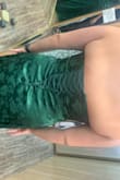 Obsessed with the material and color! This was my bridesmaid dress and was very comfortable throughout the night. I fluctuate between sizes 8-12 so I ordered a Large but should've gotten an XL. when I wanted to exchange it for the XL it was sold out. I was so in love with the dress and felt my best in it that I actually went to an alteration shop and they added a corset panel to the back so it would fit. I think it ended up looking cooler in the back and almost wish it was made with a corset instead of the zipper because it helped the dress stay up since it's strapless! I have board shoulders and a booty and there was no chance it was gonna zip up. I would say size up because you can always get it taken in just in case. I'm 5'6, wore 3-inch heels, and did not need it hemmed. The first photo is actually me wearing my fun sneakers underneath the dress at the reception (comfortable and can't even tell I'm not wearing heels!) After the sizing issue- overall stunning dress! - Megan P.