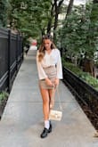 Looks just like the pics! Not stretchy material so if between size I would size up. It's great for casual events but if I wanted to dress it up I would buy a medium so it's slightly longer and I feel more secure. - Rosalia L.
