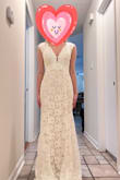 The dress felt comfortable, and of good quality. Unfortunately, I really wanted long sleeves since I'm having a Thanksgiving wedding so I went with another dress. The other dress didn't make my hip dips as prominent, and overall was a better fit (aesthetically) for me. It did need some adjustments, but so does every wedding dress. It definitely needed hemmed & the shoulders taken in. The waist also needed taken in so I didn't lose my figure in the fabric. This dress would be perfect for a spring or early fall wedding. It would look great with a slip under to give it more fullness at the bottom. The sleeves are actually just straps with lace added, a super cute touch. This would look especially good for a rustic wedding! Super cute just not what I was hoping for. - Matty A.