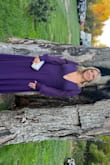 Fits true to size. Very deep V neck i used double sided tape to keep in place.  Had to have it altered because it was to long.  alterations cost me more then the gown itself.   Paired it with silver shoes and accessories.  Was perfect for a fall wedding! - Nicole I.