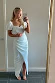 Wore this to my bridal shower and it's so cute! The puff sleeves are such a cute detail. The material is thick so I didn't need to wear a bra underneath. Not sheer at all. So flattering! - Amanda D.
