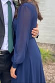 Absolutely loved this dress. Got it for a Fall Wedding in Canada. I got so many compliments and got asked multiple times where I had gotten it from. I loved the fact that it's a wrap dress and can easily adjust to my size. Had to get it hemmed (already knew this before purchasing the dress - the dress does however have an inner lining which poses an extra challenge for those trying to hem it at home). The cleavage was a bit too much for what I'm comfortable with, but with help of boob tape instead of a bra, and double-sided fashion tape to keep the dress in place, I was very happy with the result. If needed, the cleavage could be adjusted with a safety pin or a tank top/bralette. It was a great dress to stay warm in an outside wedding ceremony in October, although you will feel the wind through the thin sleeves. I did however get extremely hot in the dress when the party was moved inside and the dancing begun. - Gabriela P.