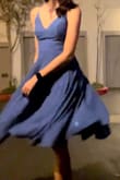 Got this as a hoco dress bc the theme was hollywood and it reminded me of the dress from la la land. I love it sooo much it's my new favorite dress. The color is bold and vibrant and the skirt light and flowy. I had to lace the straps tight or else my sticky bra would show, but after it fit just fine. - Paige T.