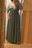 I originally had a different bridesmaid dress for a wedding I'm in that was too formal and didn't look great on my arms. I bought this dress because of the upper arm coverage, and it's so cute! It's a wrap dress, so size wasn't an issue. I'm tall (5'10) and still had to hem about an inch off of it (my shoes have a 1/2" heel). 2 layers of fabric, good quality. I'll probably pin the chest closed because it is a bit revealing when I move around since it's a wrap dress. - Andrea Z.