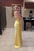 I used the Lulus size recommendation and the dress fit great. I put this dress on and immediately felt amazing. It is very comfortable, lined, and the straps do not cut in. Everyone complimented on how the dress reminded them of Kate Hudson's dress in the movie. The fabric is good quality and did not feel cheap. I would wear this dress everyday if I could. Bigger chested ladies may have trouble with a bra for this since it is open back, I just used pasties. 
The only downside to this dress was that I could not get the  wrinkles out from shopping with my iron. I had the have it pressed. - Heidi K.