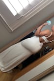 I was so excited to try this dress on & thought it would be the one by looking at the photos. It fits true to size! I normally wear a size 10 or medium in clothing and ordered a size medium & it fits perfectly. I also loved the back! However, I had to return it because the material wasn't what I was expecting. Also, there was some material that wouldn't lay flat & would just crinkle on my boob area, which really bothered me, had it not It would've been the one. - Liezel C.