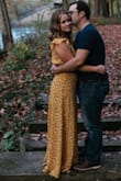 Loved the dress. First tried a small but it was a little too tight around the belly. Love the medium. Fits nicely and was perfect next to the fall colors for my engagement pictures! - Lynzie T.