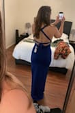 I was kind of nervous that this dress was on final sale, but I figured that for the price, I might as well get it! I was pleasantly surprised. The quality is nice, and it's super flattering and comfortable. You can adjust the straps that tie around your back to help tighten or loosen the top. The color makes it a little more unique as well - it definitely "pops" in a crowd. - Aline A.