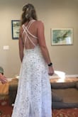 I actually really liked this dress, but ultimately it felt a little too revealing for my wedding. The top was too big for me, but that wouldn't have been a factor as I'm sure it could be tailored easily. The fabric is totally see-through with just a tan bodysuit (literally like a one-piece swimsuit with a snap in the crotch) to cover you, if you think that's ok for your wedding vibe I would totally recommend this dress as it's nice and weighty and very flattering. The back is super cute! - Molly L.