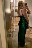 This jumpsuit is a little larger fit for juniors sizing. I'm usually a women's size medium and this medium fit well. I'm 5'6 and wore with flats and it just skimmed the floor. It's bluish green but depending on the light can look either color, mostly green. I wore a strapless bra with it. - Juliyana F.