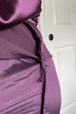 This dress is a really pretty color and I love how it fits beside the long length. What I don't like is the backstitching... There are two visible lumps and it looks like the inside was sewn incorrectly. I'm not sure if it's worth having a tailor try to fix it so I'll probably end up returning. - Nia C.