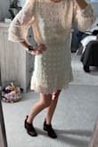 Love this dress! Wore it out for a date night. I felt so good wearing it! The cream color is a bit see through so I did wear jockey shorts underneath. The skirt fit was perfect in a M on my hips, the top was a bit more flowy/baggy but that's just how the dress is supposed to be. A definite buy if you are on the fence. I want to own in more colors! - Laura B.