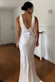 The fabric is thick and gives me a very good feeling when I'm wearing it. It runs a bit large on the bust area because I have a smaller chest. The color is pretty Champagne but it is too yellow to be my wedding dress. If you're looking for alternative color for a wedding, this is a very good option! - Mingkwan R.