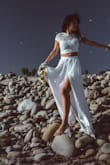 I usually wear small, so I ordered size S, but ended up exchanging it for XS. I wore it for a wedding photoshoot at the beach. It's comfortable and photographs great! The skirt is a bit long for me, but that's usually the case. Had to ask for help to close the top, so have a friend/partner on standby to zip you up ;) - Bianca M.