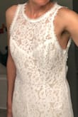 I loved the lace and the smooth lining. It's very light weight too. I'm not used to having a train and it tended to fold on itself when I walked around. I loved the fit around my hips but didn't fill out the chest. I have an athletic build and small chest. - Amy F.