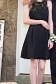 Simple and modest in the front. Tasteful peaks of skin in the back. Fit perfect. My daughter was so happy with this dress. - January P.