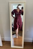 This dress is beautiful! The sleeves and wrap style are very flattering. I wore it to a fall family wedding and it fit the occasion perfectly! I used a safety pin to hold the top together for a bit more cleavage coverage. It felt comfortable during the dancing and various activities. Highly recommend! - Sarah W.