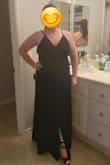 No zippers which is a plus in formal wear in the XL sizes. Fit great and felt comfortable. As others have mentioned it has a high slit, so I wore shorts. And it's long on my short frame, but I wore platform wedges and it worked fine. I got a few compliments at the wedding and felt great the whole night! - Katelyn F.