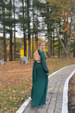 I bought this dress for a fall wedding. I was nervous about the girls falling out, so I used a bit of boob tape for extra security but honestly now having worn it, I don't think I needed it! I got soooo many compliments in this dress, I felt like I really stood out as a wedding guest. I didn't have to get it hemmed because I'm on the taller side and wore heels, but it does come long so prepare to get it hemmed if you're on the shorter side. Only downside is the button at the top in the back came off as I took the dress out of the package. Luckily my best friend can sew so she fixed it for me, however for the price it shouldn't have happened in the first place. Otherwise, a really lovely dress that I think would look nice on a lot of body types! - Kristen K.
