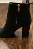 I love these! They look better than I expected. You can only see the color in the light and they look like Amber Gemstones. But otherwise like regular nice black heels. - Dahlia K.