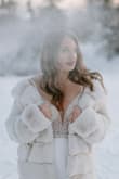 This dress is heavier than it looks - which was actually great at our outdoor December wedding in Alaska! I was able to wear leggings under the dress and no one knew, and the thick fabric kept me warmer than I though! - Brittany R.