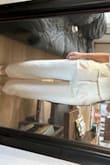 The front pleats look a little weird.. If you are more curvy you might need to size up and take the waist in. Overall the quality is nice and the color is super cute ivory. Does have some stretch! - Sedona A.