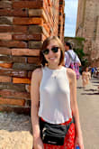 I literally own three of these. So comfy, flattering, and match absolutely everything! I bought these for a trip overseas and ended up buying a third because I wear them so much even at home. Cropped, but will reach mid-rise waist pants. I did size up as I am normally an XS. You will not regret this purchase! - Darien S.
