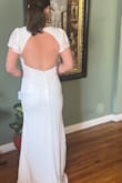 I was skeptical about this dress being the one at first, but as soon as I tried it on it felt different. I came out and showed my mom and my bestie and their faces said it all! I had tried on two different dresses from Lulus but this one felt the most bridal on my body shape. I was in this dress for a good half hour just feeling really great. My wedding is at a small restaurant and has a really romantic feel. This dress makes me feel like a bride.
I'm not sure why the photos uploaded sideways, but I hope they capture how the dress really looks. The weight and material feel really good quality. I love how the open back is still high enough to hide shape-wear.
I really recommend this dress! It's both simple and detailed with the lace. I'm thinking of either adding a skirt attachment or a belt. - Lucianne C.