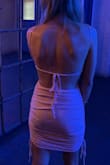 The ruching and open-back details are very sexy and flattering. Maybe the top doesn't fit me correctly, but I found the strap placement in the front to look a little weird. - Michelle L.