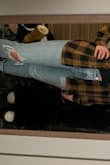 These jeans fit really nicely on the waist and are fitted through the hip and thigh. If you have thicker thighs, I would probably size up. They aren't very stretchy but feel very high quality. - Penny M.