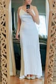 This is such an exquisite gown and quality material. It hugs my curves in all the right ways and makes me feel so elegant and graceful. The high low feature provides the same timeless feel as having a train without the hassle of having to dance around it or bustle. I would highly recommend this dress for any occasion and am so excited to wear it on my wedding day. - Kylie W.