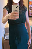 This is a very pretty dress and the color is great. I agree with other reviews that the top runs small. I was just able to get the Size S zipped with a lot of help and it was really tight. I liked the way the bottom fit better in the S but had to size up to M for comfort in the top. Also it was very long. I wore flats so had to hem it a lot (not easy with a mermaid style) but think only the very tall or those wearing very high heels wouldnt have to hem at all. Finally, I found it challenging to iron or steam the fabric which is on the thicker side.  Even with all these caveats I really liked the dress. Its a solid option for someone who wants fuller coverage up top! - Kristin W.
