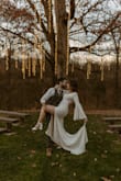 I bought this dress for my wedding this month. The sleeves, the train, the neckline, it was perfect. This dress is gorgeous and achieved all of my fairytale dreams. It was so comfortable to move and dance in. The arms were a little tight around the armpits and I couldn't quite raise my arms straight up but I didn't notice it day of. I added a wrist loop to the train and pinned the nude lining to the lace skirt. - Teresa A.