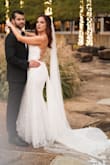 I am not a size 10, but had to order that size AND get it taken out in order to make this gorgeous dress wearable on my wedding day. I'm normally a size 4-6 lol, but my hips are like 38/40. This dress was so pretty though so I don't regret the purchase, but did need to get the length hemmed, even when wearing 4 inch heels. Also had the tailor put a button on the train so I could pin it up for the reception! - Stacy R.