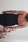 This dress fits perfectly, hugs body like a glove, not too tight.  Very comfortable. I only have minor issue, the back doesn't seem to look like on the pictures I've seen - mine is higher on the back, would prefer more like photos. But all together dress is great, good material, and fits perfectly. I'm very pleased with my purchase.  Can't wait to wear it.  Definitely will buy again. - PETRA K.