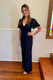 This jumpsuit is incredible, I felt beautiful! I bought a medium even though the website suggested small, and I'm glad I did. My chest size made it a bit difficult to zip up, but it still worked! So I would size up if you have a similar situation. - Danielle P.