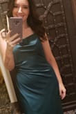 I am obsessed with this dress! It sits well and doesn't accentuate rolls or "soft" spots. Even though it's spaghetti strapped, I didn't feel exposed at all! It is a bit big in the bust area, but I wasn't uncomfortable at all. The slit does rise a bit when you sit, so be wary of that (especially if you're wearing Spanx). I felt pretty and confident the entire night, and I can't wait to wear it again! - Chelsea C.