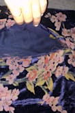 This is a beautiful dress, but the quality is just not there. Thank god it is fully lined with navy fabric. Wore this to a wedding and as I sat down at the ceremony and took off my coat, I noticed the seam at one hip completely shredded where that floral design is, about 4 inches in length. I tried using clear double sided fabric tape to strengthen the material and restitch it but it just continued to shred more and more throughout the night. When I got home, I also noticed the back seam, from the bottom of the zipper to the slit in the bottom completely opened up and shredded as well. Extremely disappointed and expected better. Only wore once, never washed or anything and just completely fell apart. Will likely not be making any purchases from Lulus in the future as it is not worth the risk with such abysmal quality. - Andie M.
