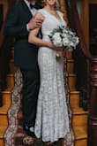 This dress is true to size and does have some stretch/ give to the fabric. Cannot believe how well this fit me. Had to wear flats or else the dress would have been too short. Beautiful lace. - Laura C.