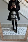 It's super cute but does run big. I bought skirts from Lulus before that were a size S and they fit perfectly but these do run big (see pics). It's too late for me to return as I wore it already but would recommend a size down if you're about my size. - Kat C.