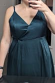 As others stated in their reviews, the dress needed alterations in the bust. I also found that it puckered a bit between the center of each boob and the armpit area. After sewing up the middle, some of the puckering went down, but still didn't fit 100% as I would have liked. I ordered the emerald green and as others stated, it had more of a jade green hue to it. Length was a little long in <1" shoes, but definitely fine for the night. I usually wear a 16 and ordered a 1X which fit perfectly around the waist.
I included photos of the dress as it came and after my friend helped sew the dress - Robin S.