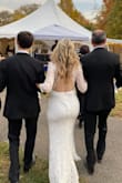 The fit was perfect. I had it hemmed about a 1/4" because I wore 2" heels and I'm short! A tip from my tailor to wear double-stick tape for the lace on my back was brilliant. Worked like a charm! I could've worn this dress for days. Tons of compliments! And of course, the groom LOVED IT and showed him the curves he likes but was still elegant and tasteful. - Jennifer M.
