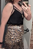 I really love this skirt. I knew I wanted a leopard print satin midi skirt, and there are a lot out there. I chose this one because I love that the print has blue in it. The satin is thick, luminous, and a little bit stretchy and flares a bit after the hips so I think it is very flattering. The facing ends about three inches down from the top of the skirt, which makes for a tiny ridge there that is not my favorite thing in the world, but overall I love the skirt. I'm 5'10" and it falls at a nice length below the knees. - Emily W.