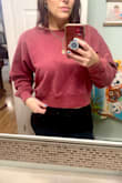 I love this sweater.  Bought it in black and white and now burgundy too.  I'm tall so crops usually are too short on me but this one is perfect.  The material is nice and thick. - Mary C.