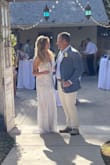 I read all reviews and looked at all the REAL pictures trying to pick my wedding dress. This is a second wedding so I wanted one that would be elegant and classy. This one was absolutely perfect. I went with the recommendation to buy one size down for a tighter fit (XS). So many great compliments and everyone loved this dress. It made me feel like a princess on my special day. - Becky E.