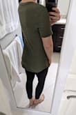 I have a couple of these shirts already and they are long, but this one is particularly long. Definitely a tunic on me. I can tie it up and it's fine, but it looks a little ridiculous if I wear it down because it comes all the way past my butt in the back. Otherwise, the material is soft, breathable, and not see-through. Good basic, I just wish it was 2 inches shorter. 5'4", 130 lbs, 34D, 27" waist, purchased size small. - Lindsey F.